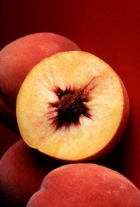 Photo of peaches cut in half