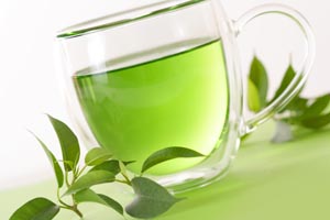 photo of a glass cup of green tea