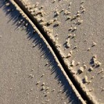 Photo of a line drawn in the sand
