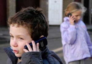 photo of children on mobile phones