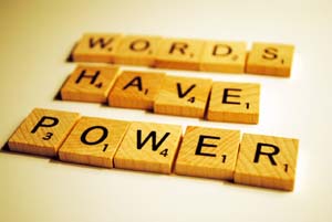 Photo of scrabble tiles saying 'words have power'