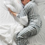 Photo of a man asleep in bed