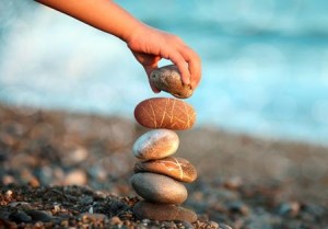 Photo of a hand stacking stones