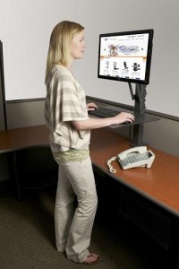 Photo of a woman at a standing desk