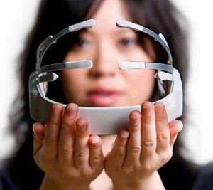 photo of a woman holding a neural controller for a computer