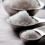 Photo of measuring spoons full of salt