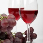 photo of grapes and a glass of wine