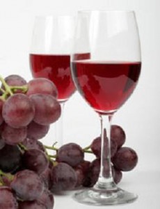 photo of grapes and a glass of wine