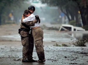 First responder comforts a victim of natural disaster
