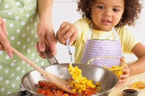 Photo of parent & child cooking