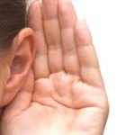 photo of a hand behind an ear