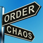 Photo of a sign pointing to order and chaos