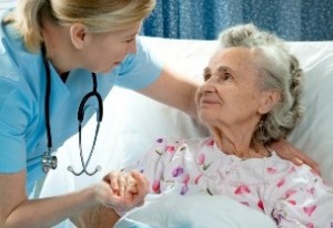 photo of an older woman in a hospiital bed