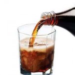 photo of cola being poured into a glass