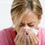 Photo of a women sneezing