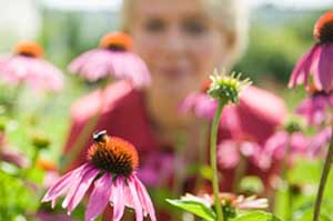 photo of a women in a field of flowers