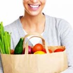 woman with a bag of healthy groceries