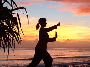 photo of a woman pracicing tai chi