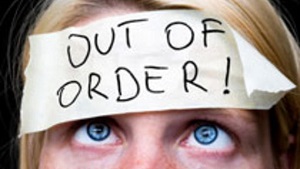 Photo of a woman with an 'out of order' sticker on her head